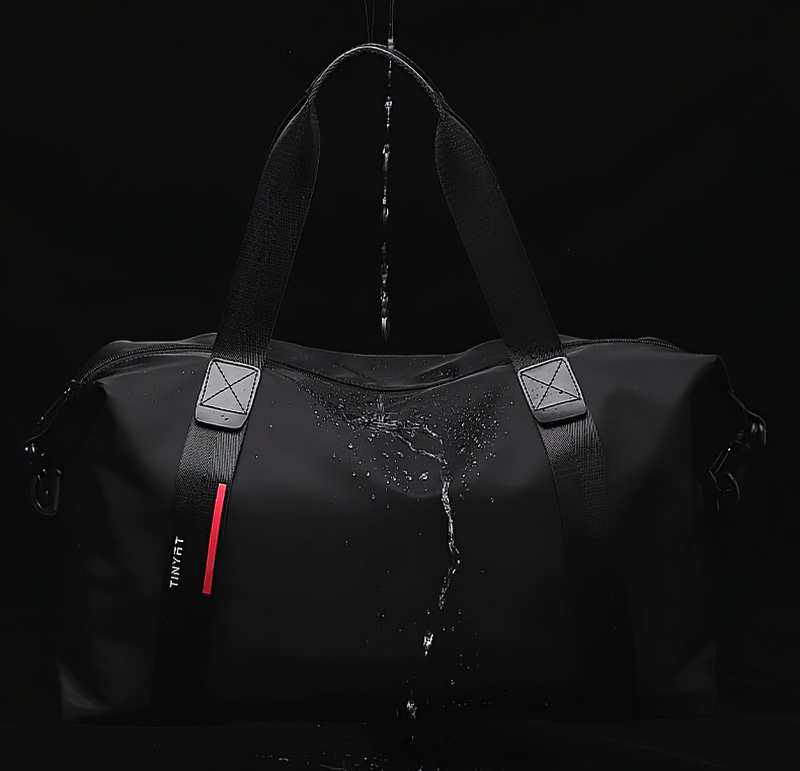 Waterproof black sports shoulder bag with zipper, ideal for fitness-focused travelers, made of durable nylon and large 20-35 liter capacity.